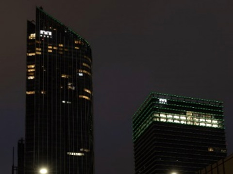 Toranomon Hills Mori Tower and Toranomon Hills Business Tower lit up in green